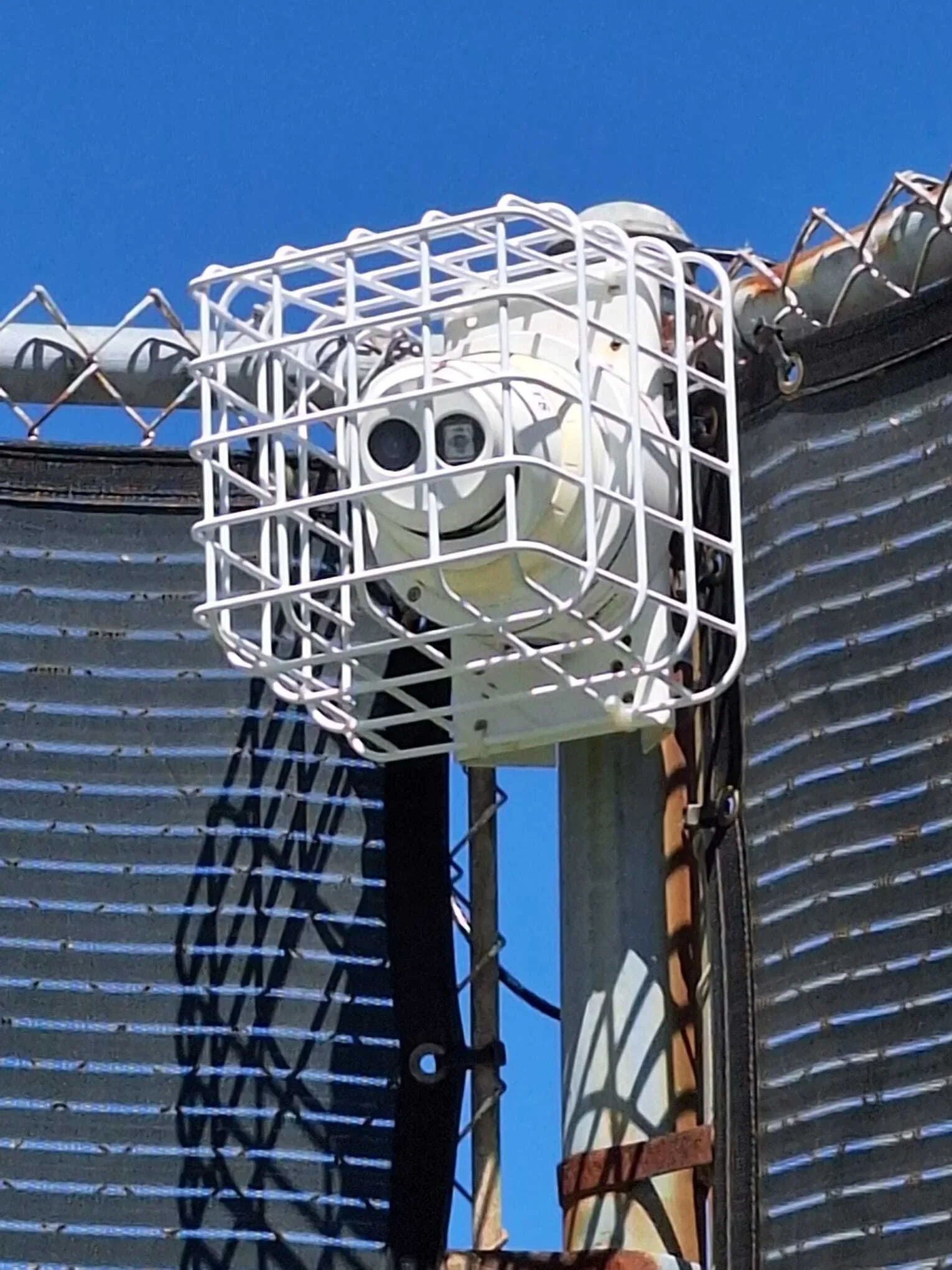 Security camera system installed on commercial building exterior